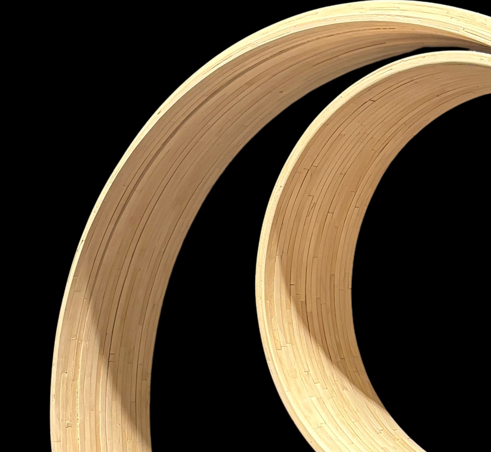 Becoming — two craft stick loops nested off-center, one inside the other